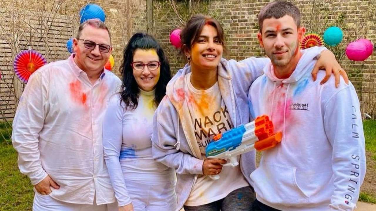 Priyanka Chopra-Nick Jonas get smeared in colours during celebrations, pose with his parents