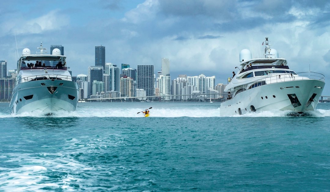 Kayaker Dane Jackson Surfs Wake Between a Pair of Miami Yachts